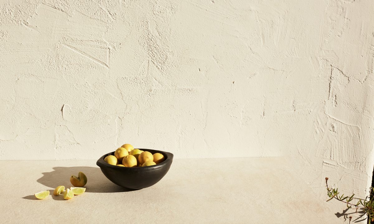 lifestyle image of a bowl of lemons
