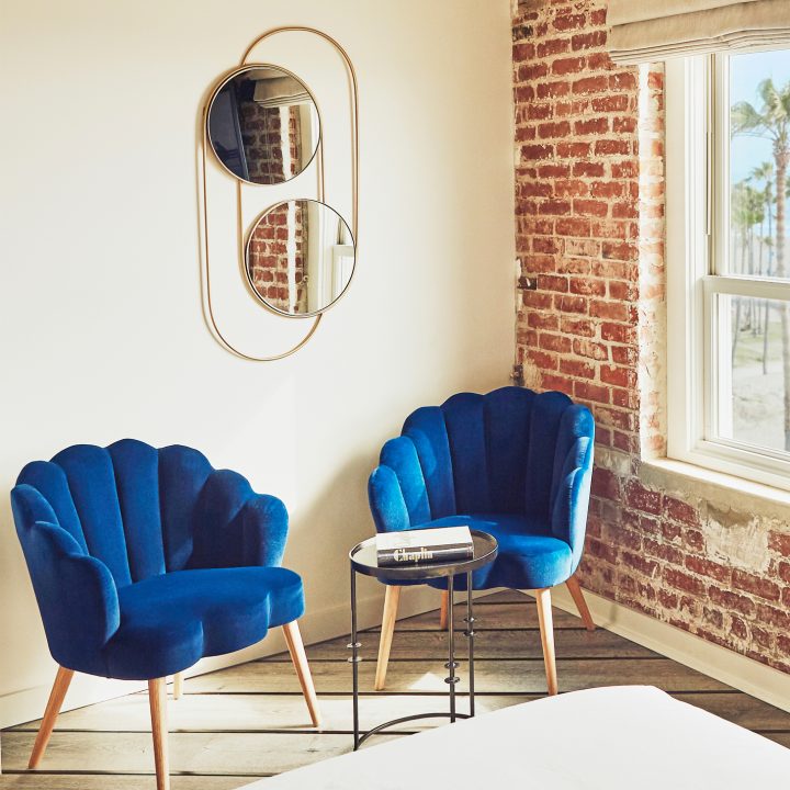 table with two royal blue chairs