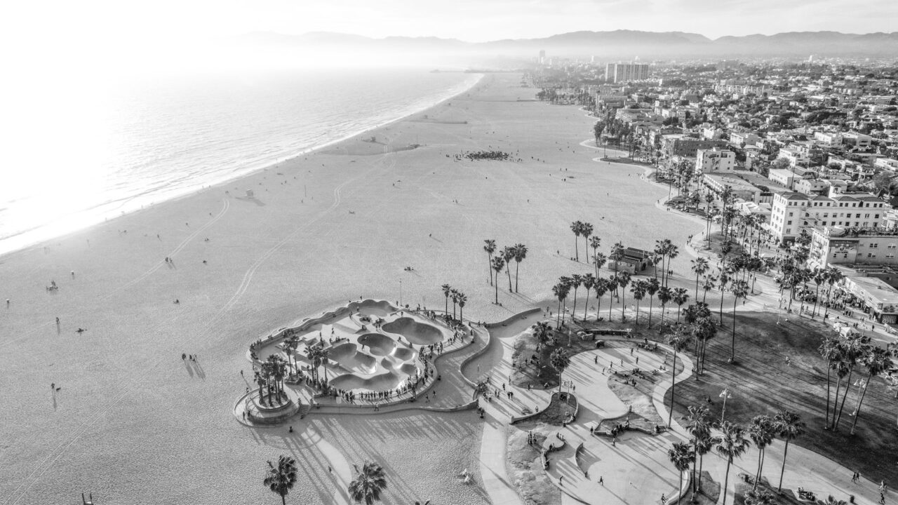 An aerial photo captures the stunning beauty of the beach from above.