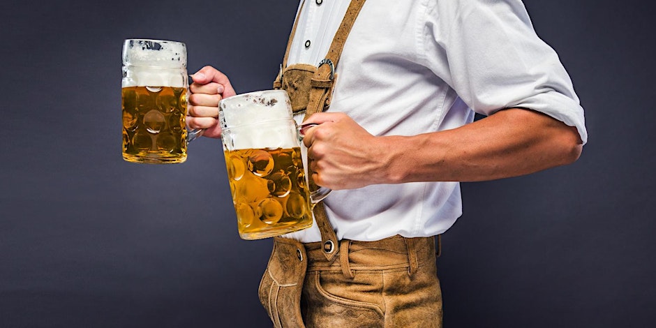 A man expertly balances a full beer glass in each of his hands.